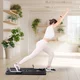 Reformer do pilatesu inSPORTline Trancer Basic ∙ antypoślizgowa deska ∙ składana konstrukcja ∙ stacja na telefon - Fioletowy